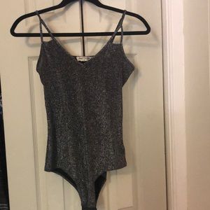 Glittery sparkly bodysuit with snap closure!